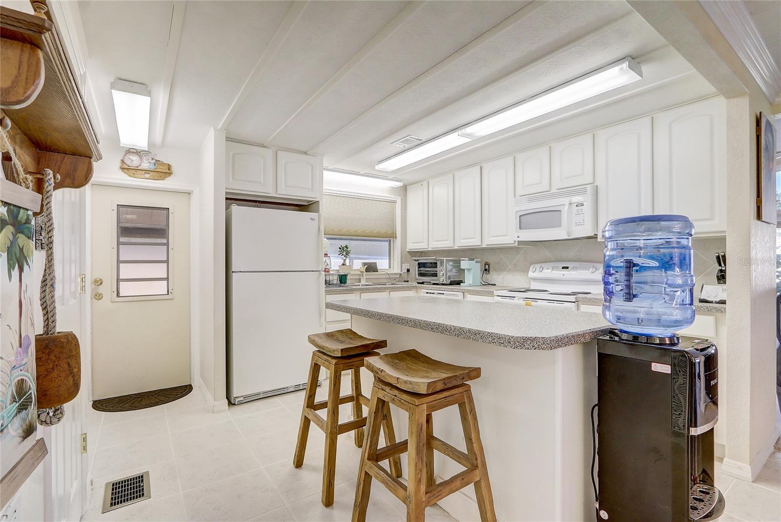 Spacious kitchen with eat-in bar area