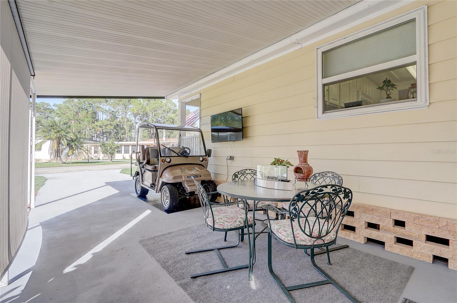 Great carport with seating space to enjoy the outdoors.