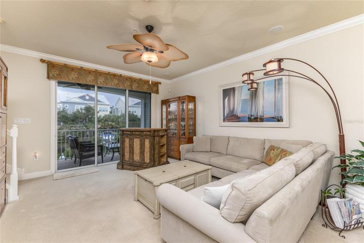 Living Area with Balcony Access and water view!