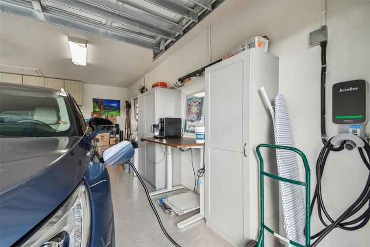 Hypoxy painted floor, EV Juice Box, Custom garage door.
