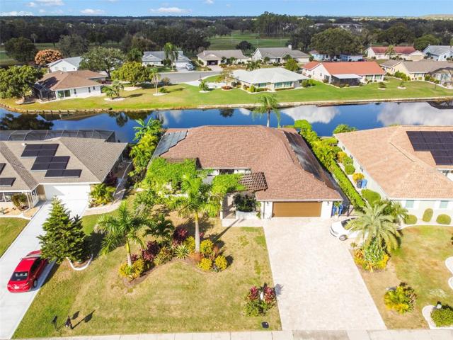 . Metalfencing surrounds the sides and rear of the home, pergolas in both the front and rear of the home. 12x60 covered rear porch with outdoor kitchen has multiple dining areas and a walkway to the lake.