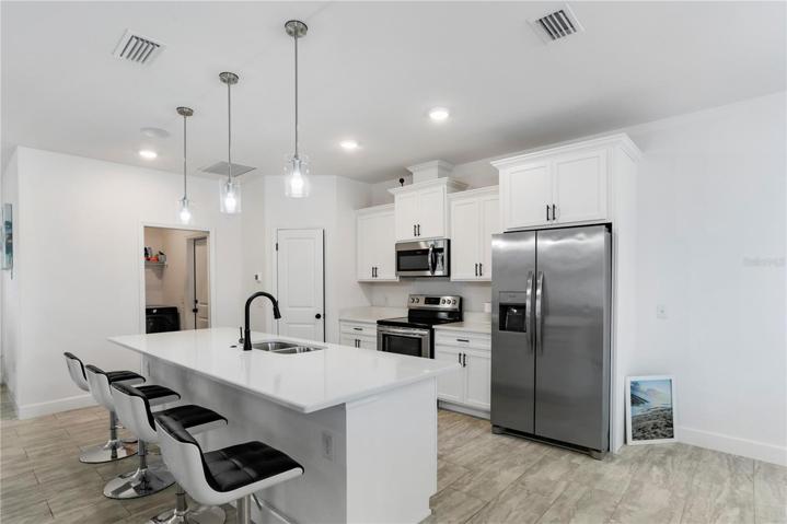 Shot shows the entrance to the laundry room & garage.