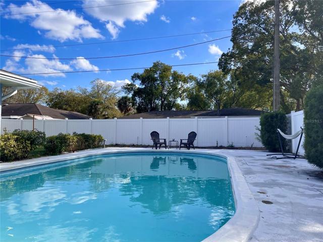 View of the pool seen from the outdoor BBQ area