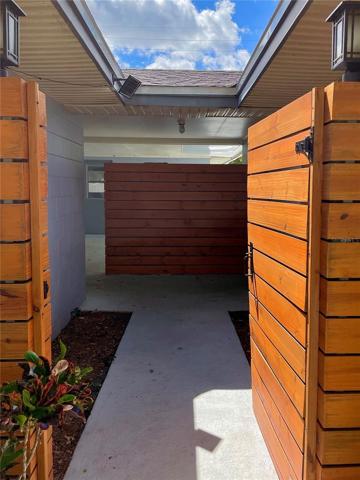 Entering through the front gate into the breezeway