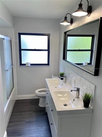 The main/full guest bathroom located off of the second living room