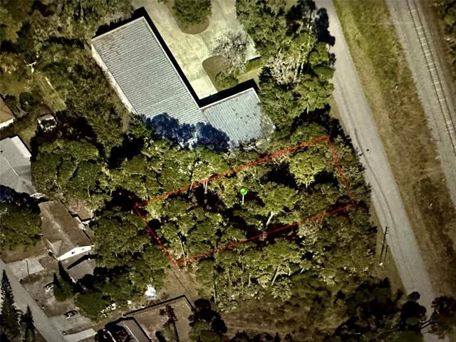 Deep lot directly on Hibiscus in an industrial area of Edgewater