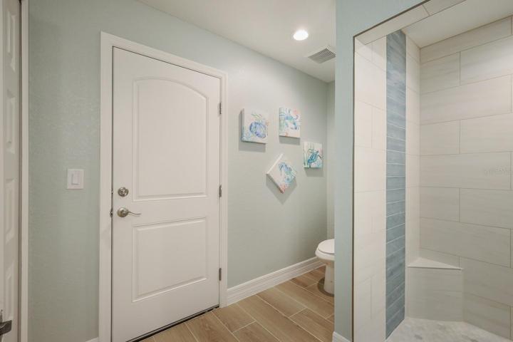 Owner's bathroom has access to pool area