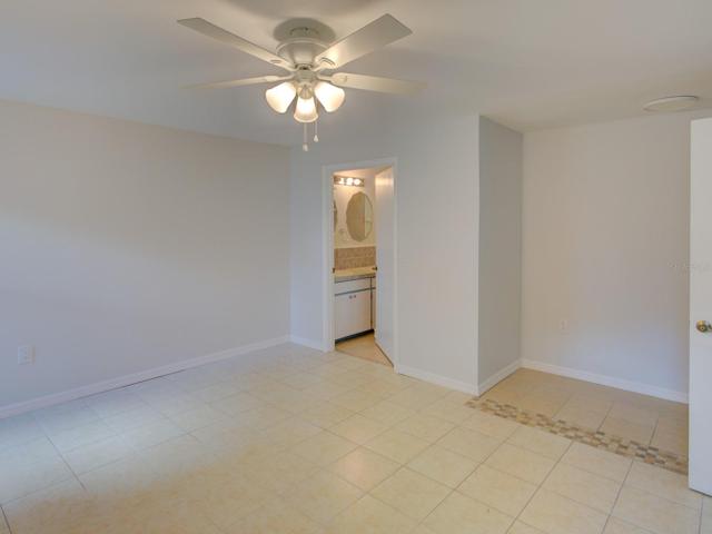 Master bedroom with an office area. Looking towards the master bathroom.