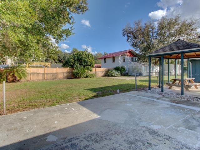 Back yard. Concrete slab that could be used for an enclosed porch.