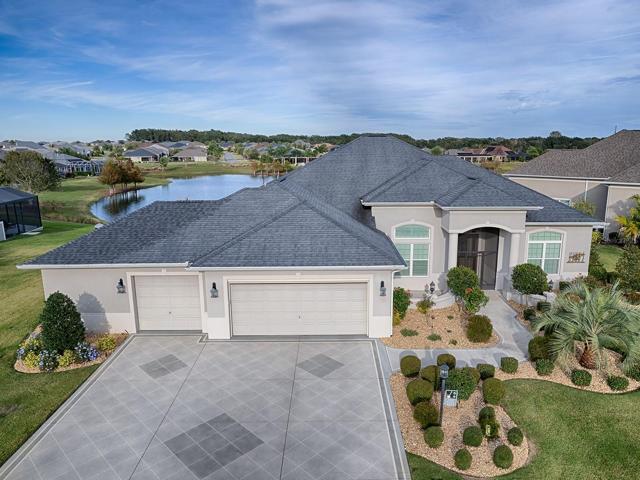 STUNNING 3/2 ST. CHARLES PREMIER WITH OVERSIZED 3 CAR GARAGE AND WORKSHOP LOCATED IN THE PRESERVE IN PINE HILLS!  FABULOUS LAKE VIEW!