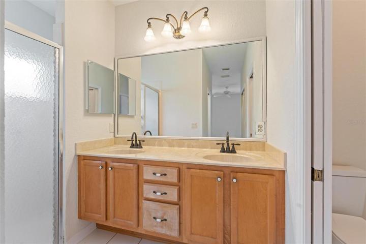 MASTER BATH with stall shower and sliding door to toilet. Accessible from the master bedroom throu