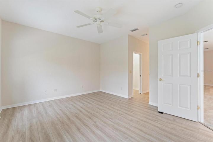 MASTER BEDROOM with WALKWAY TO MASTER BATH.  This master bedroom supports two walk-in closets.