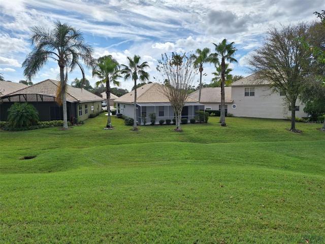 9010 HEATHLAND CT. BACKYARD, only steps to the clubhouse.
