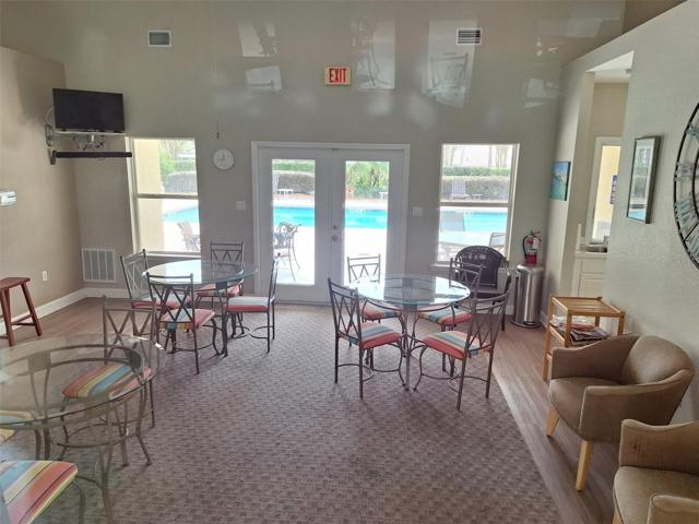 CLUBHOUSE with view of pool area