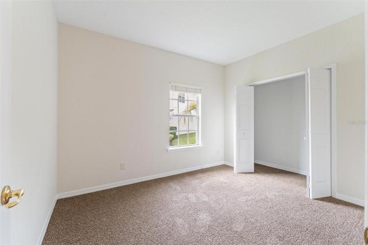 GUEST BEDROOM showing open closet