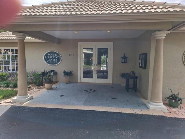 FRONT ENTRANCE OF CLUBHOUSE shared exclusively with residence of Saint Andrews and Saint Ives.