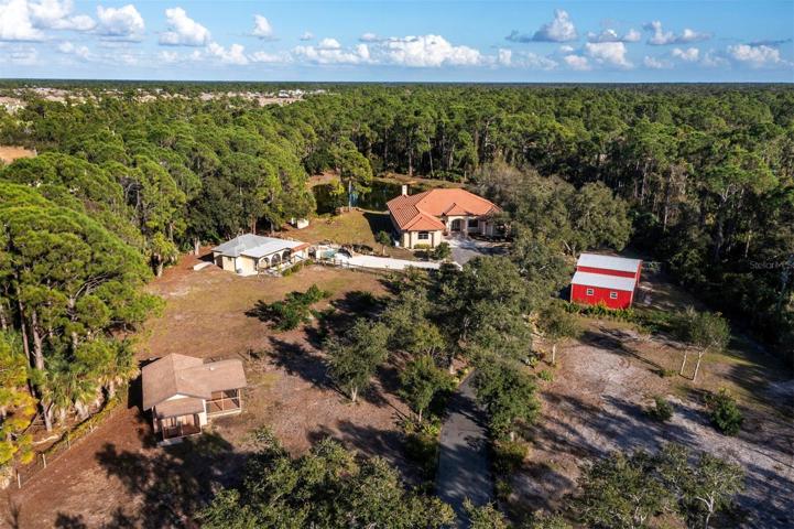 Welcome to 101 Hanchey Blvd. Over 5 wooded acres with a private pond and guesthouse.