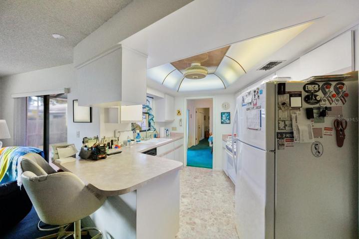 Kitchen opens to the family and dining rooms