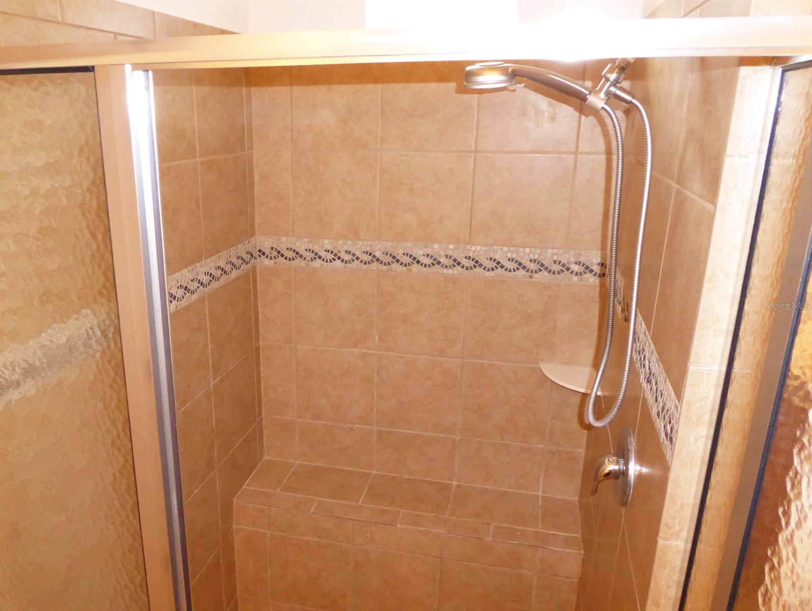 Primary bath shower with bench