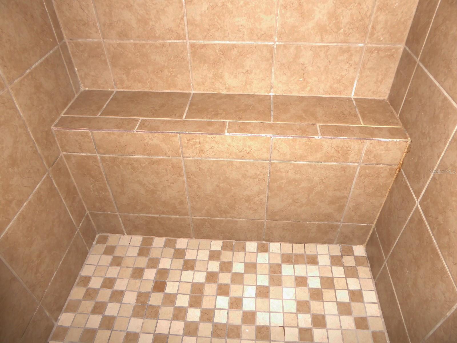 Close up of built-in shower bench