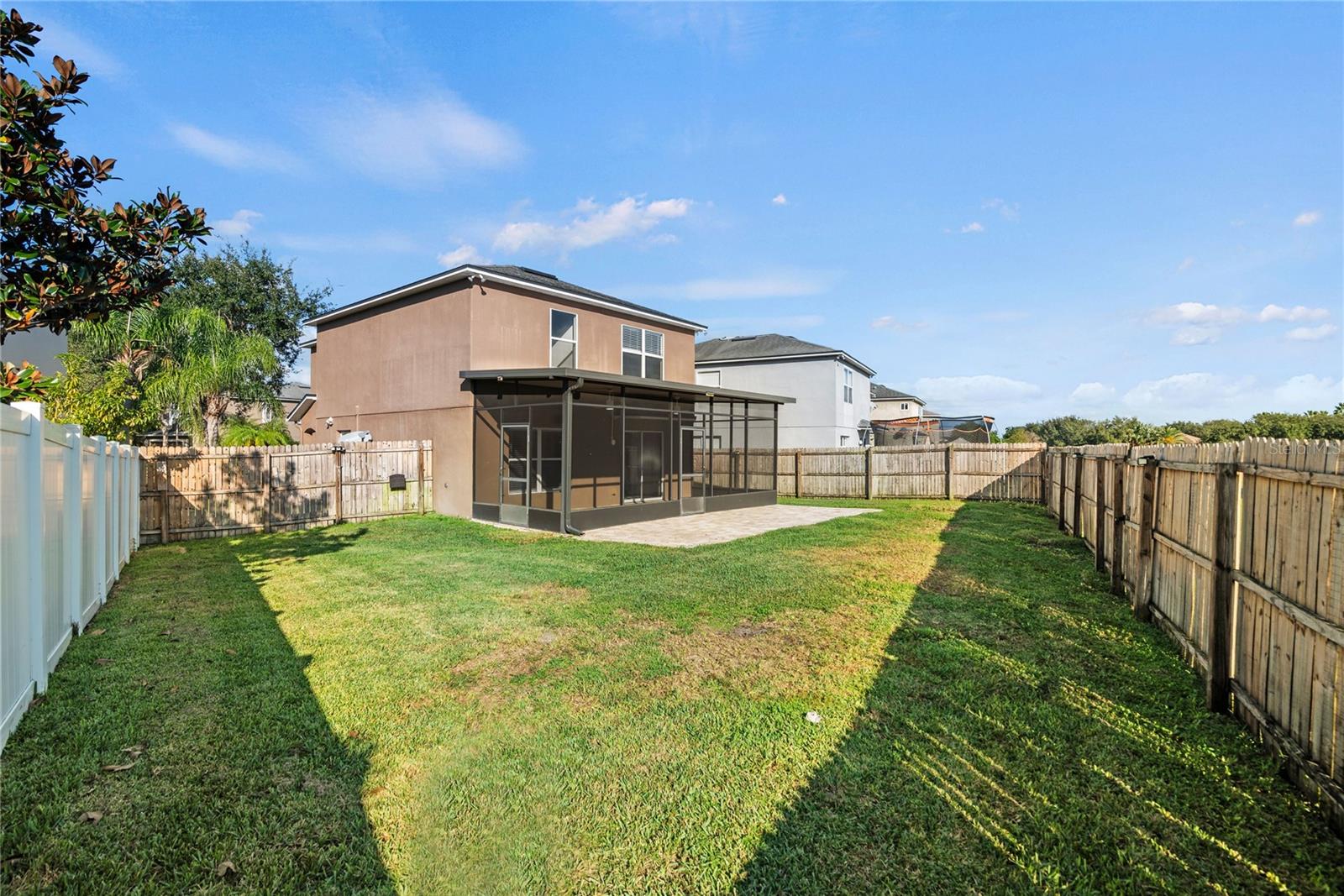 Spacious fully fenced in back yard that backs up to conservation.