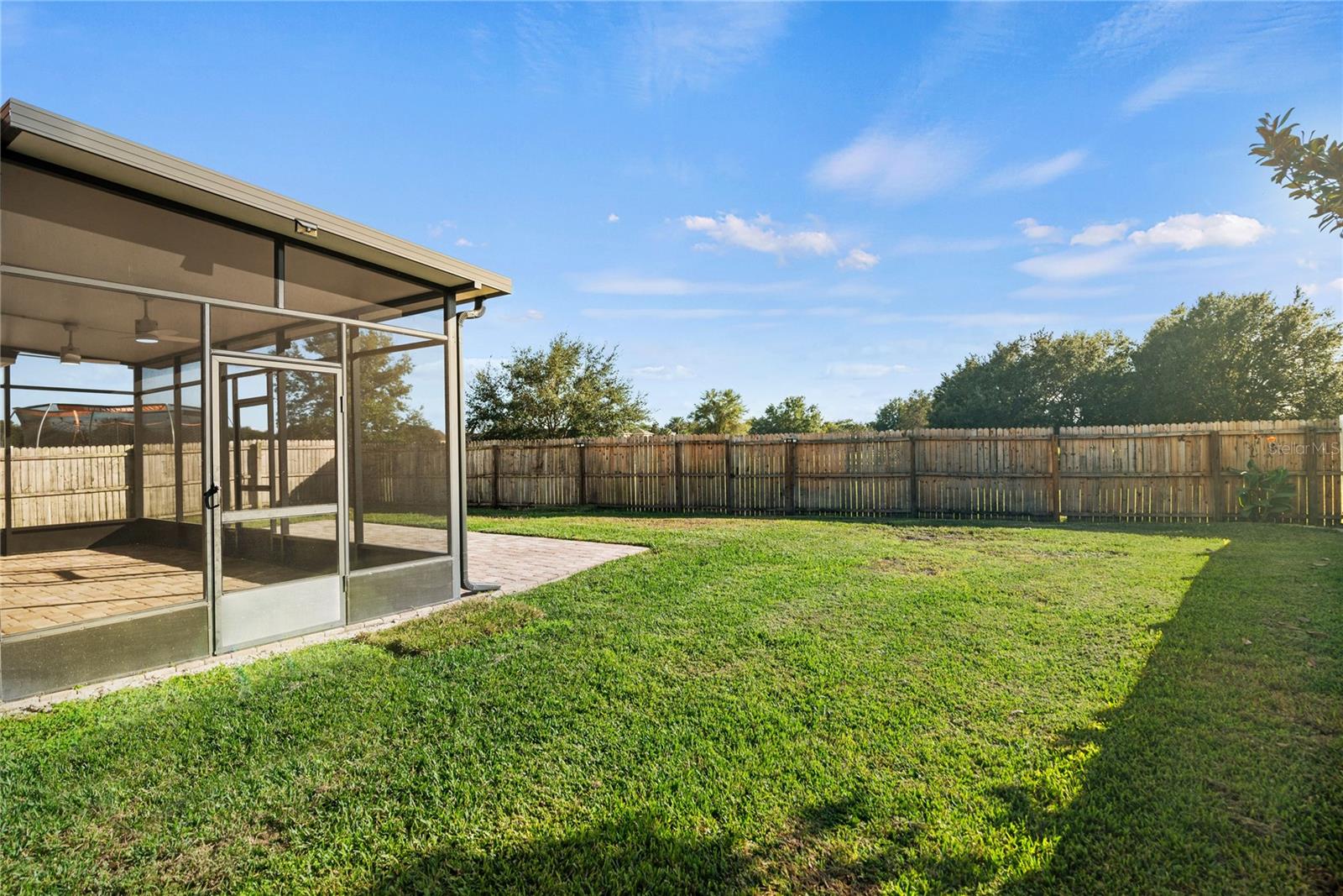 Spacious fully fenced in back yard that backs up to conservation.