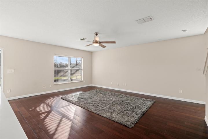 Family Room with solid wood flooring offers a bright and open space to enjoy.