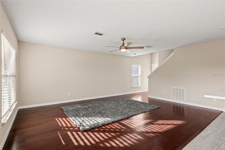 Family Room with solid wood flooring offers a bright and open space to enjoy.