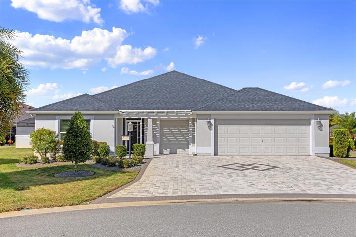 Stone Paver Driveway, Pergola, Screened Front EntrywayExtended Garage + Golf Cart Garage