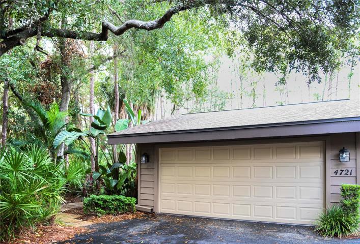 TWO CAR ATTACHED GARAGE AND WOODED SETTING