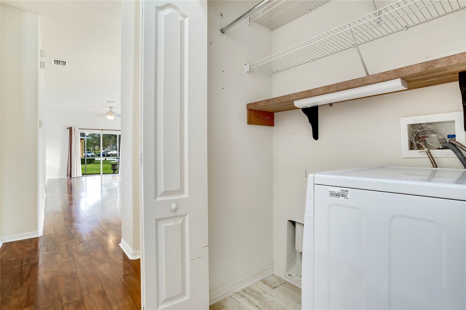 All in one washer/dryer unit in laundry closet