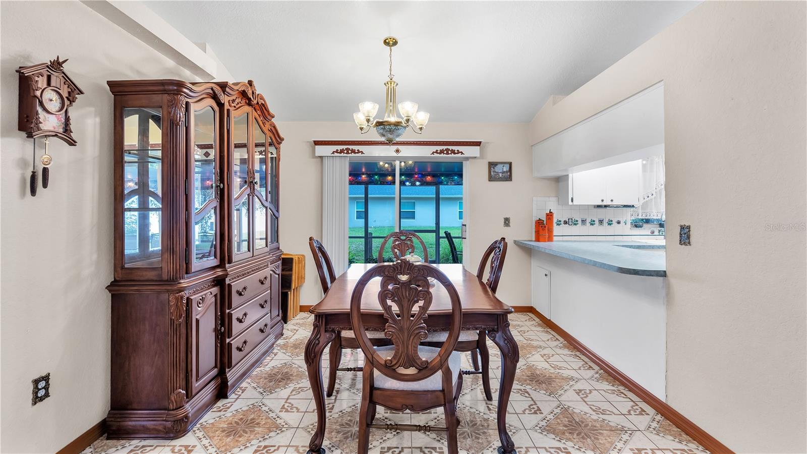 DR From LR to Sliding Glass Doors to Screened In Porch