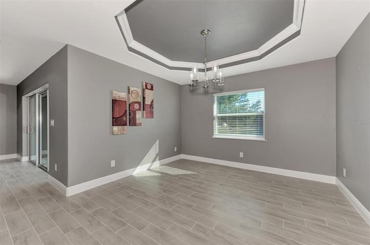 Dining Area with Tray Ceiling and Chandalier