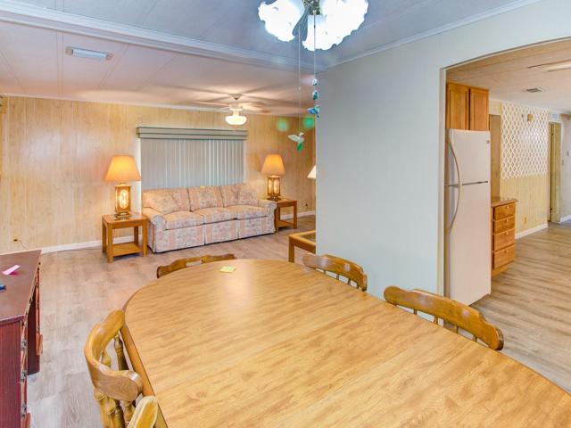Dining room with view of the living room and kitchen.