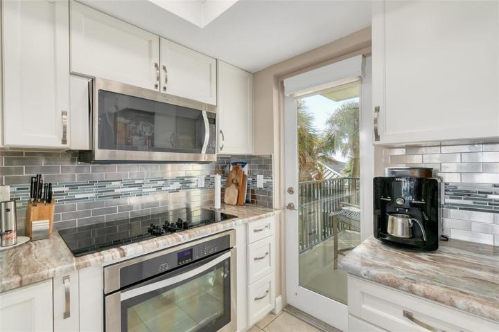 kitchen with built-in oven and microwave