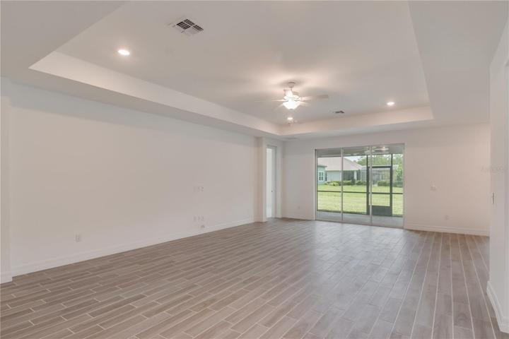 Living Room w/ Triple Sliding Glass Doors