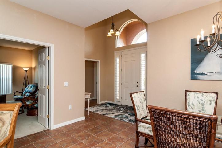 The foyer gets great natural light from the over the transom window and sidelights. The door to the 2nd and 3rd bedrooms are in the background.