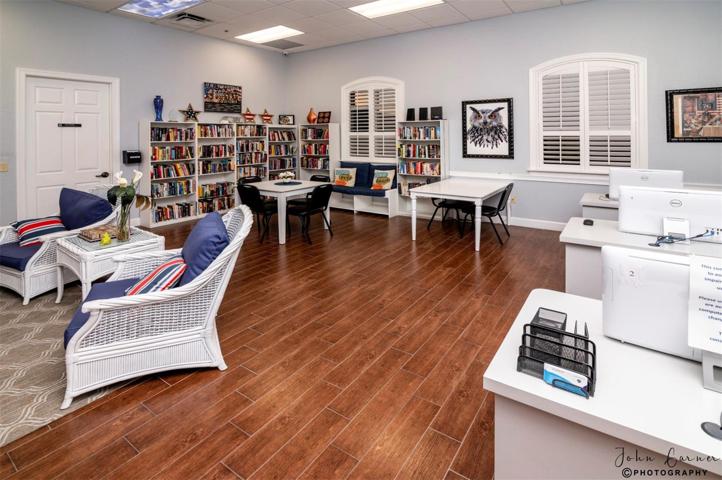 The Health and Fitness Center media room has computers for resident use and an honor system lending library.