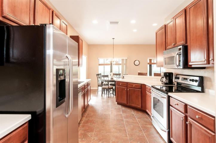 The kitchen has ample counterspace and lots of cabinetry.