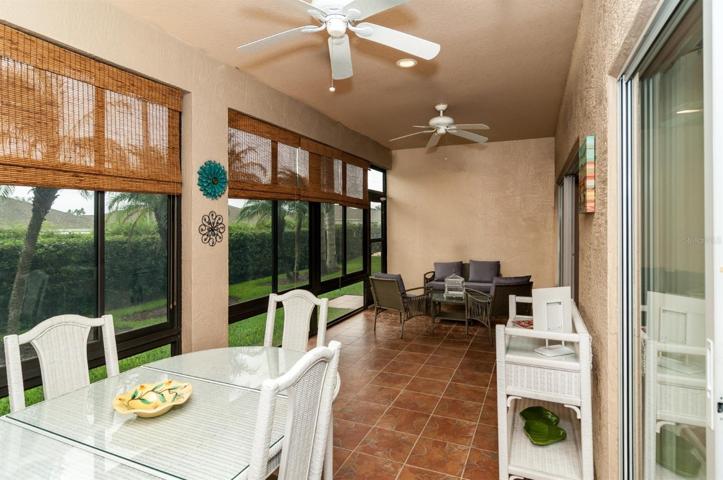 The covered and enclosed lanai is accessed by a triple slider in the living room and a double slider in the dinette.