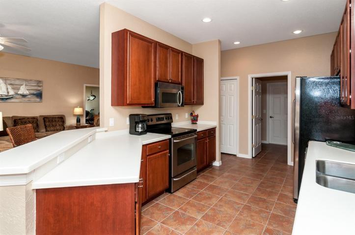 The kitchen has a closet pantry. The doorway leads to the inside laundry room and eventually to the attached 2 car garage.