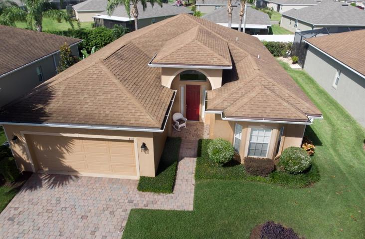 The paver walk and drive add to this home's beauty.