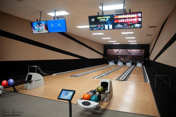 The main clubhouse bowling center has automatic scoring, house balls and house shoes. Bowling is free for residents.