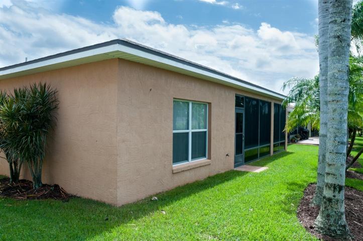The rear of the home is dominated by the enclosed and covered lanai.