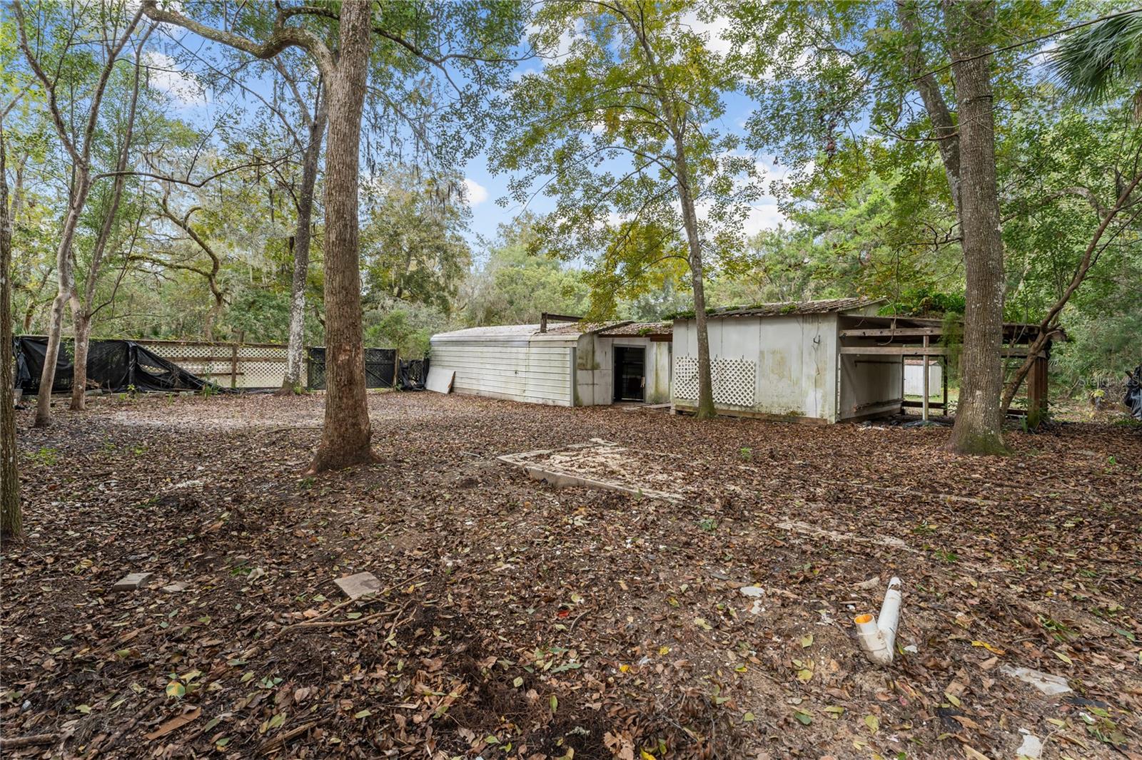 REAR VIEW OF WORKSHOP/GARAGE AND STORAGE BLDG