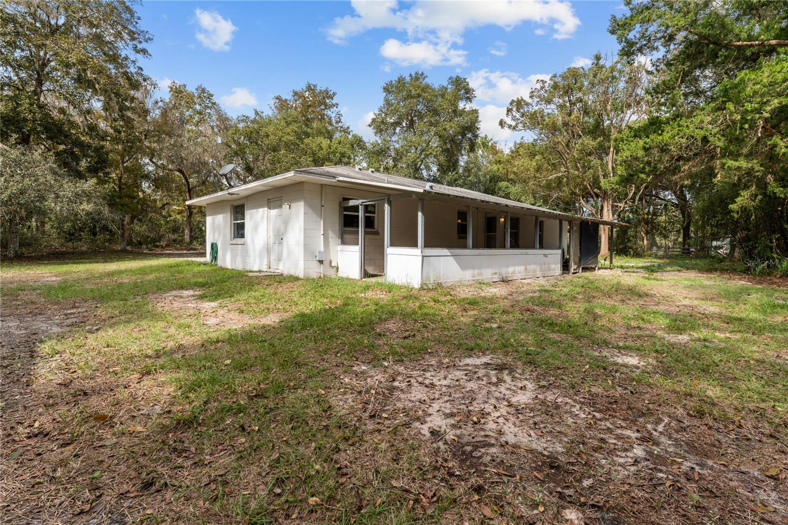 REAR VIEW OF HOME/COVERED BACK PORCH
