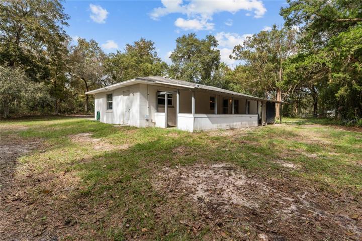REAR VIEW OF HOME/COVERED BACK PORCH