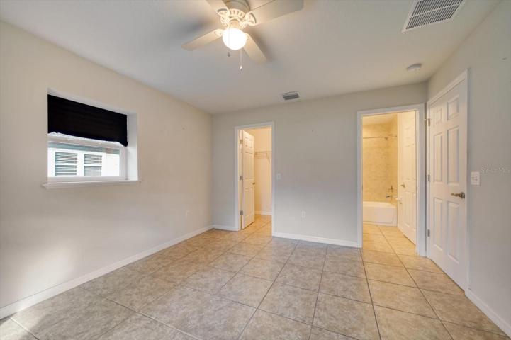 Second bedroom view to walk-in closet and Jack-and-Jill Bathroom