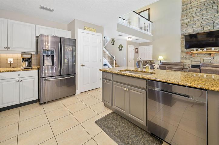 island with sink, garbage disposal and dishwasher.