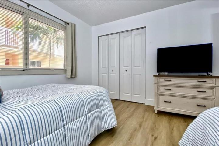 Second bedroom also has additional storage and flat panel TV